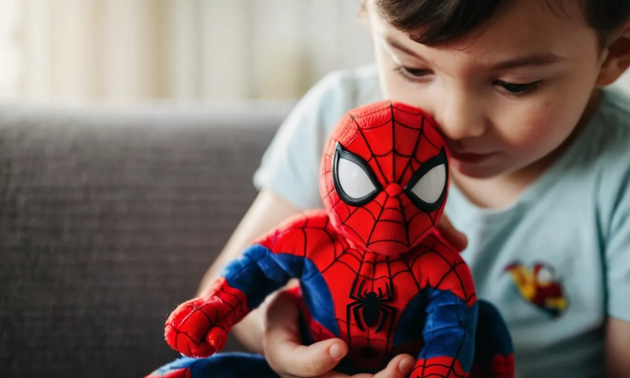 A close-up shot capturing the vibrant colors and intricate details of a Spiderman stuffed animal, with a child's hand lovingly clutching it, showcasing the perfect blend of heroism and cuddliness.