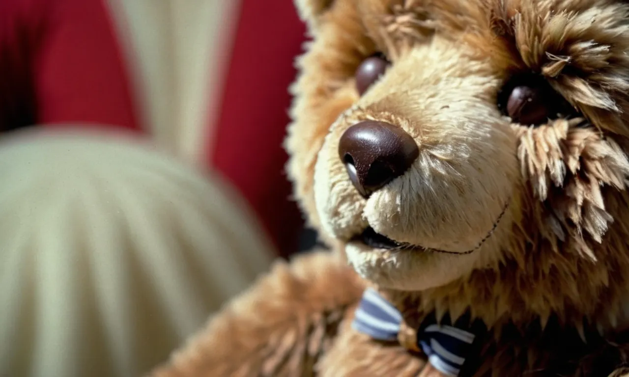 A close-up photo capturing a vintage teddy bear with worn fur and a faded tag, showcasing its age and rarity, symbolizing the worth and collectible value of stuffed animals.